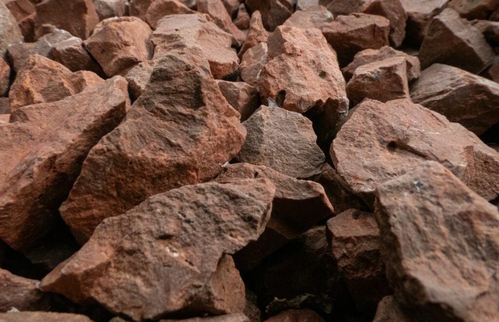 A pile of rough red rocks.